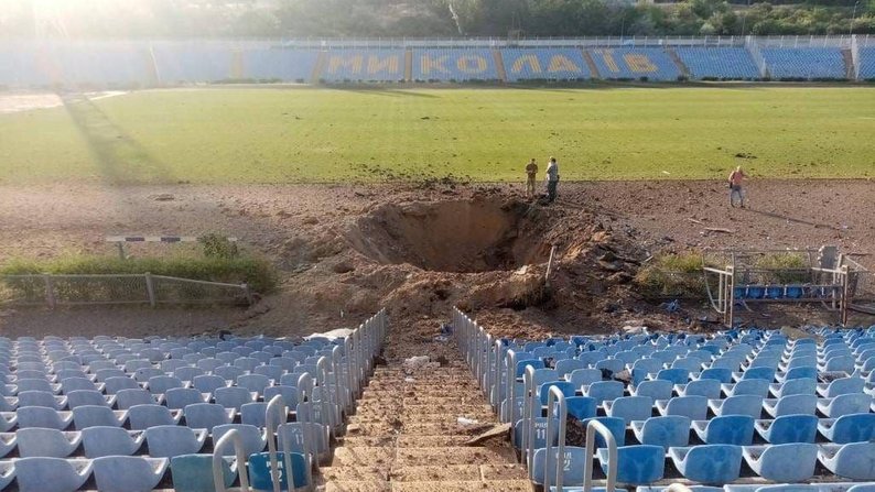 The explosion crater from a Russian missile at the Mykolaiv football club stadium
