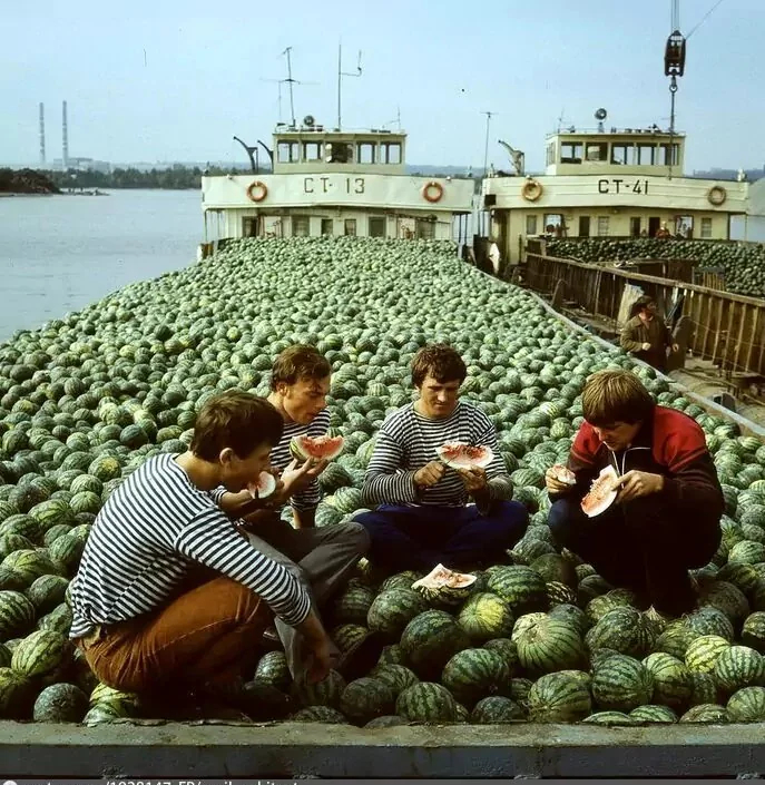 Four men eat Kherson watermelon on a barge in 1984