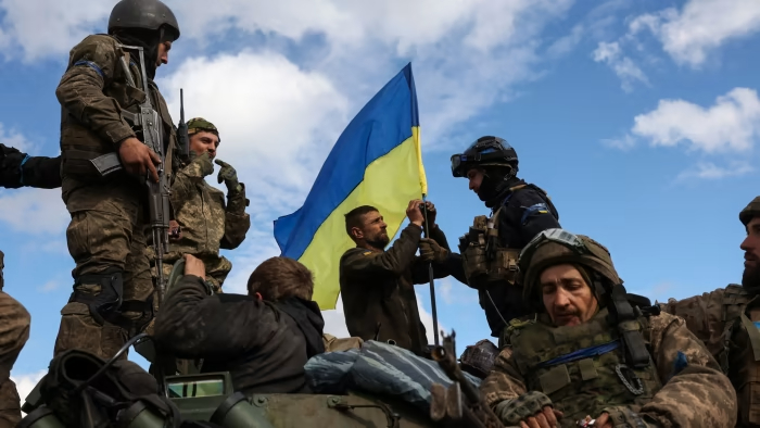 Ukraine Independence Day 2024: Ukrainian soldiers hoist their national flag to an armored vehicle in the Donetsk region.