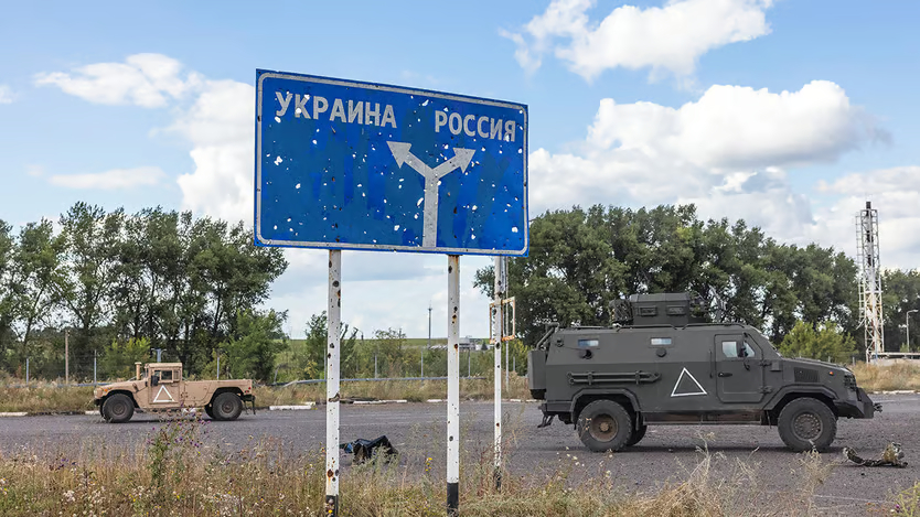 Ukrainian military successes: Ukrainian military vehicles stand behind a damaged sign near a border post in Sudzha, Kursk region. Photo: David Guttenfelder/The New York Times