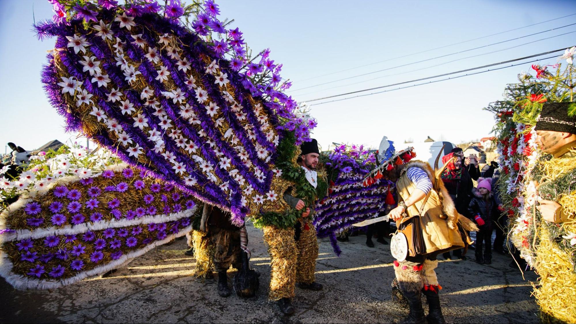 Ukrainian New Year traditions: Malanka participants wear bear costumes with wings.