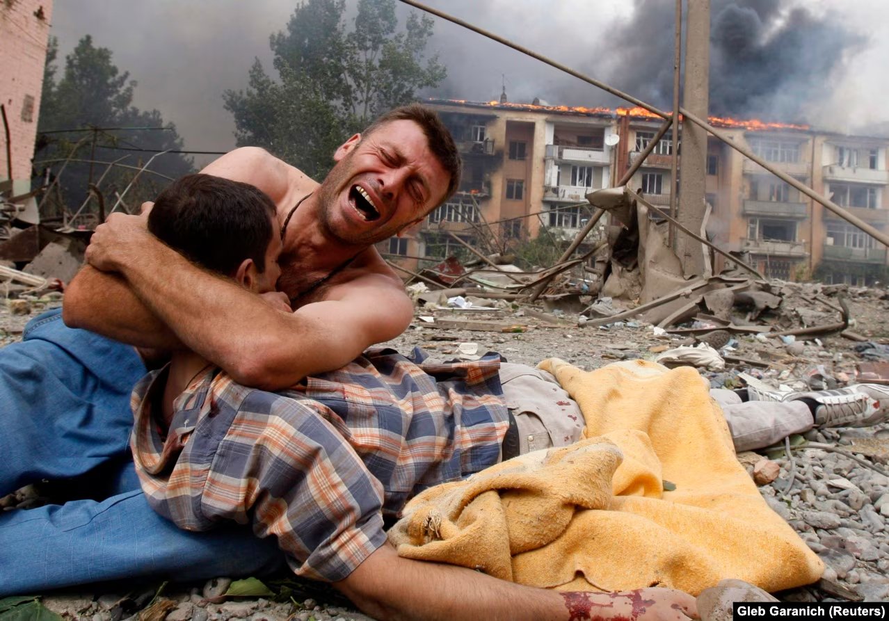 Invaded by Russia: A Georgian man cries, holding the body of a loved one after a Russian bombardment on August 9, 2008, in Gori, Georgia